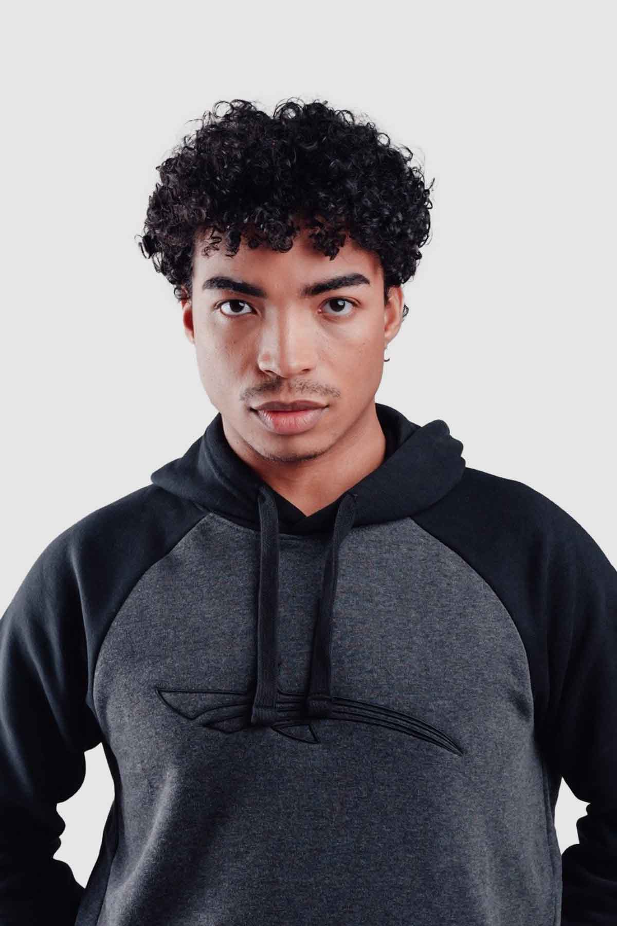 model wearing a bali edition hoodie from oceanman color black and grey